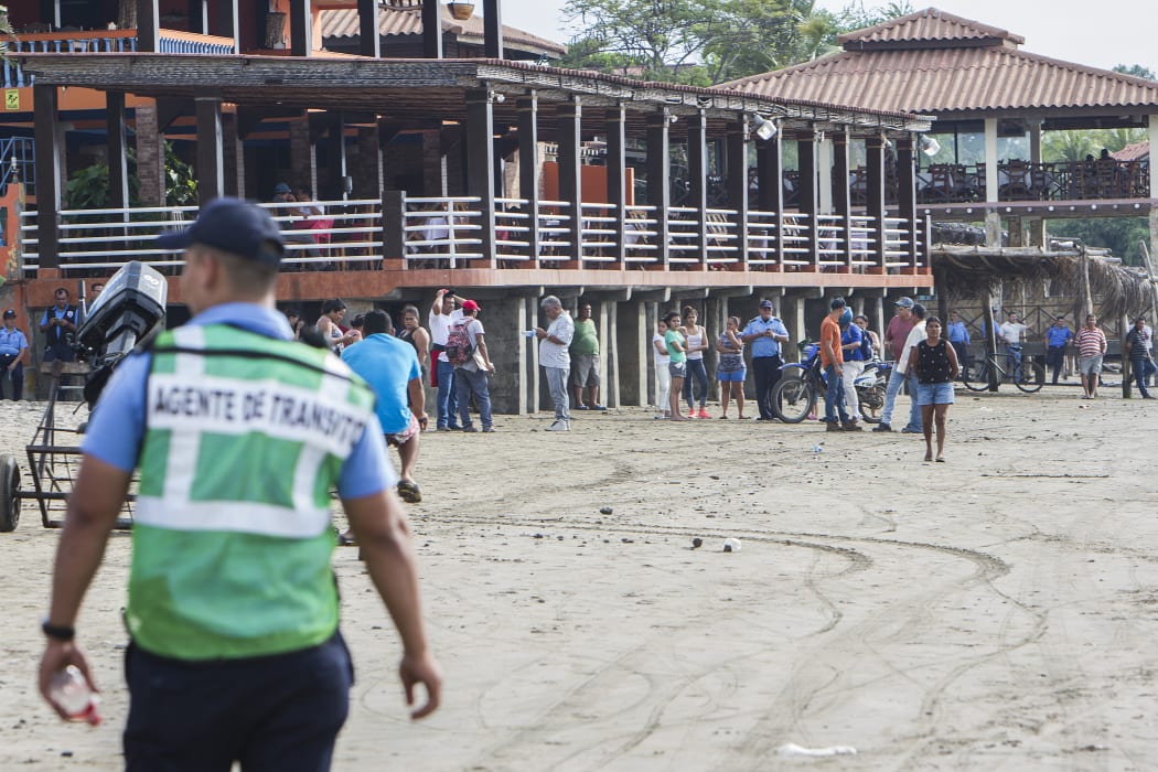 Residents of the Masacahapa seaside resort in the San Rafael del Sur municipality, Nicaragua stand by on the ready in case of tsunami alert after the region was hit by a 7.0 magnitude earthquake.