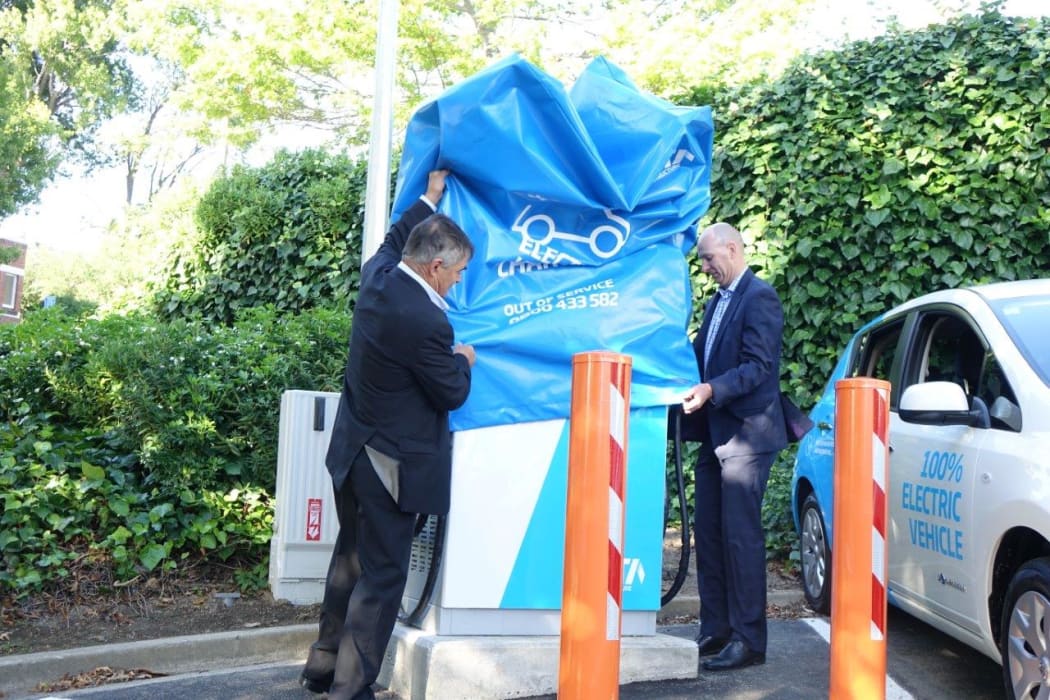 Dave Cull and Grady Cameron unveiling the new fast charger for electric cars.