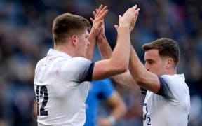 England's Owen Farrell celebrates with George Ford.