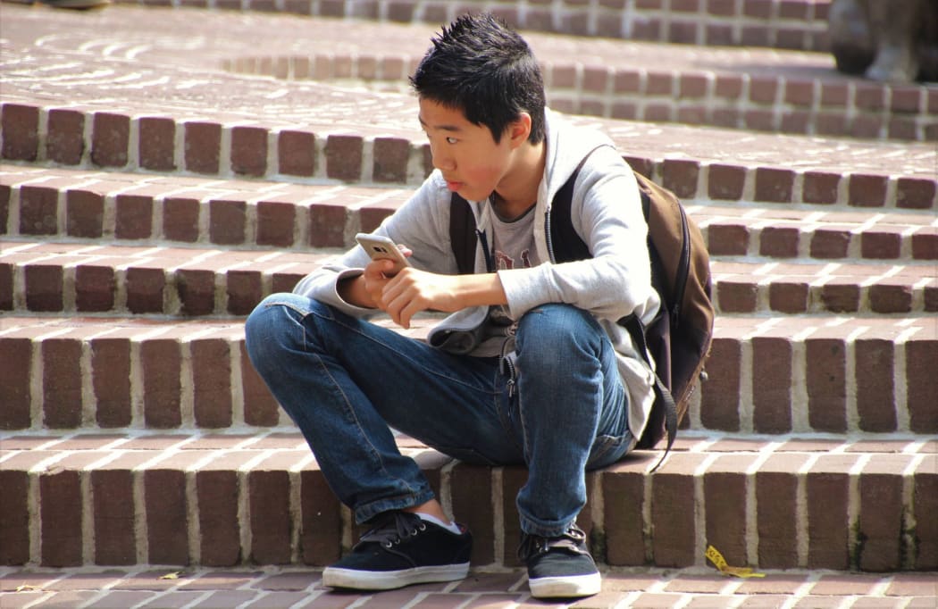 Asian boy on steps