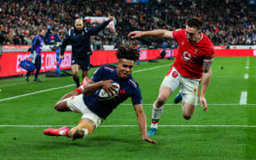 France's Théo Attissogbe scores their first try in the opening match of the 2025 Six Nations rugby tournament against Wales. Josh Adams is the defender, 1 Feb, 2025.