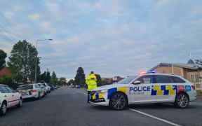 Armed police have cordoned off a residential area of the Christchurch suburb of Avonhead as they continue to negotiate with a person who has locked themselves inside a property.