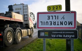 A photograph taken in Montreuil-sur-Ille on December 12, 2023 shows a road sign indicating the exit of the French city of Montreuil-sur-Ille, western France, which has been turned upside down as part of an action of FNSEA and Young Farmers unions to denounce an agriculture policy that "works on its head" (Photo by Damien MEYER / AFP)