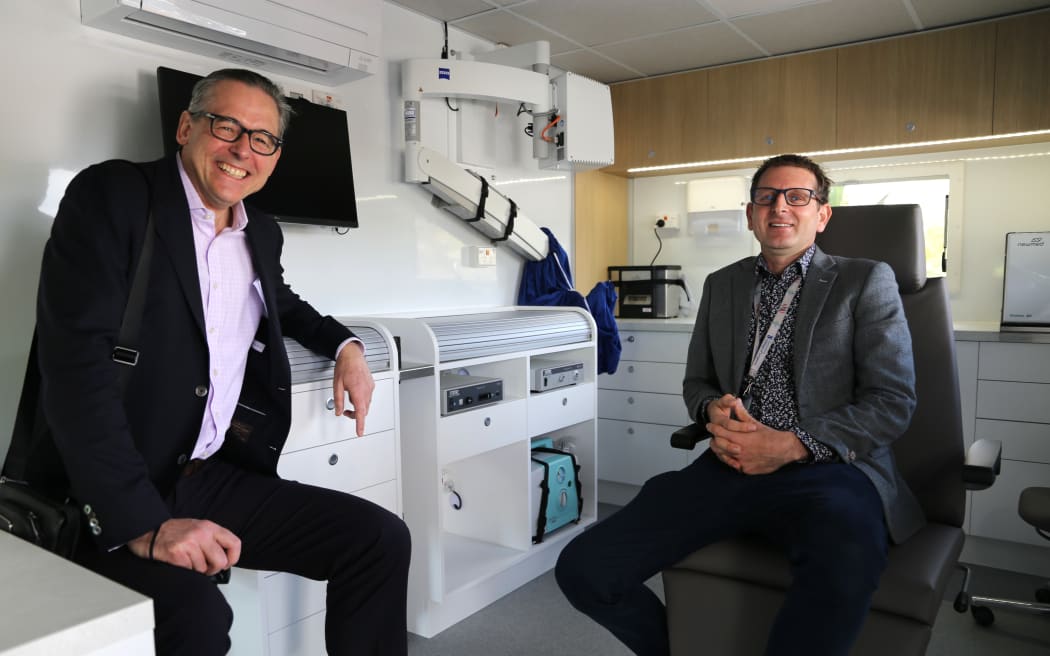 ENT surgeons Richard Douglas and David Waterhouse in the newly donated mobile ENT clinic.