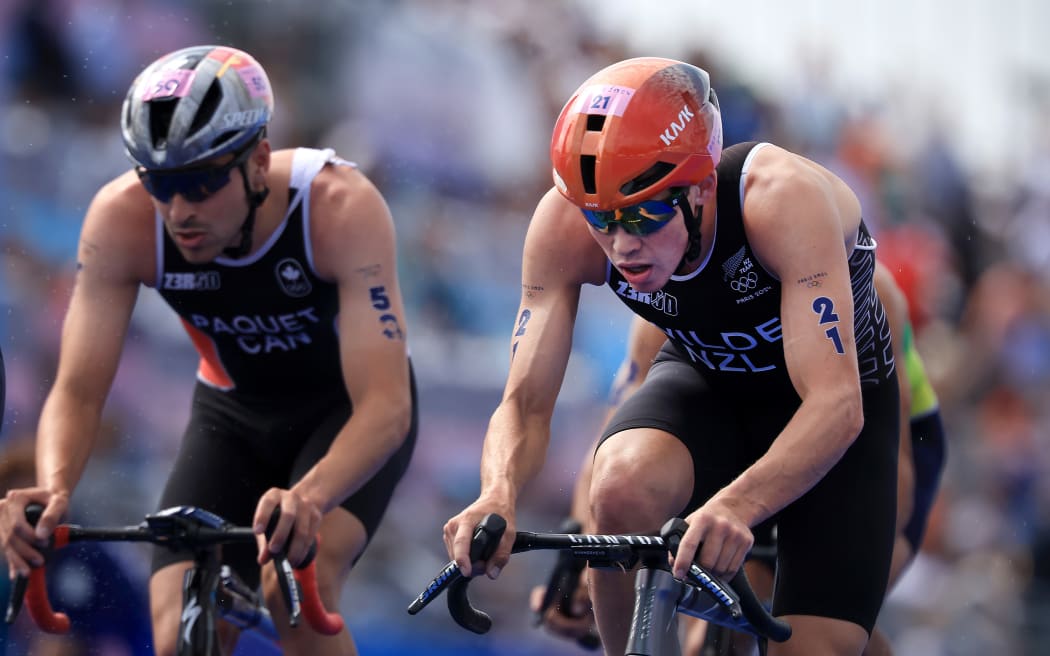 Hayden Wilde of New Zealand (right) on the cycle leg during the Men’s Individual Triathlon at Pont Alexandre III, as part of the 2024 Paris Olympic Games, in Paris, France.