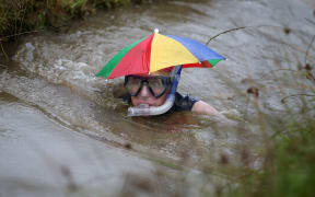 A competitor in the annual World Bog Snorkelling Championships, held in Wales