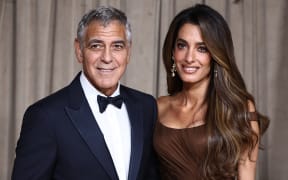 US actor George Clooney and Lebanese-British barrister Amal Clooney arrive to attend The Albies hosted by the Clooney Foundation at the Natural History Museum in London on October 3, 2025. The Clooney Foundation for Justice (CFJ), provides free legal support in defense of free speech and women’s rights in more than 40 countries. The Albies is the Clooney Foundation for Justice's annual event honoring courageous defenders of justice.