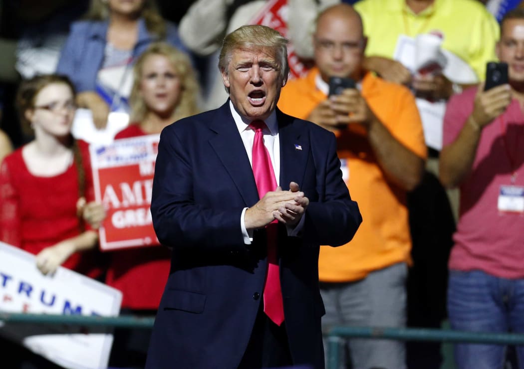Donald Trump speaks to the crowd at a rally at the Mississippi Coliseum.