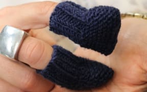 Booties knitted by students at Hasting's Girls High School for premature babies.