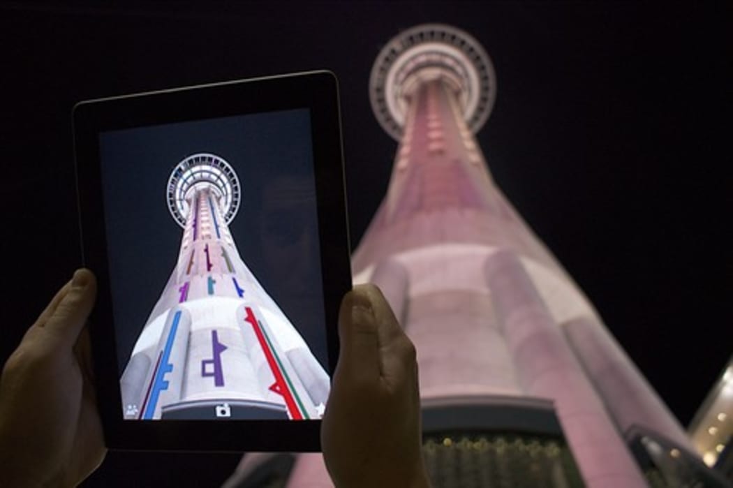 An image of a digital projection onto Auckland's Skytower  by artist Shannon Novak.