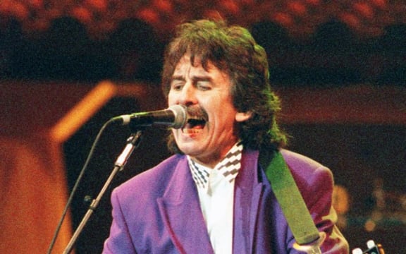 New York 1992 showing George Harrison performing "Absolutely Sweet Mary" during an all-star tribute to the music of Bob Dylan at Madison Square Garden.