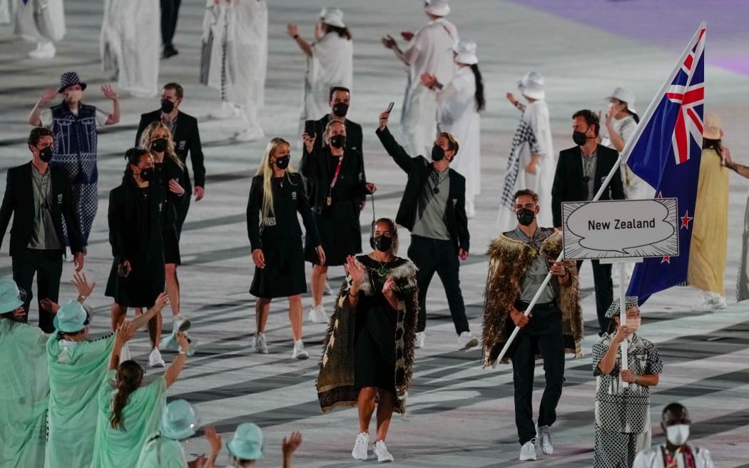 David Nyika and Sarah Hirini carry the flag during the Opening Ceremony of the Tokyo 2020 Olympic Games.