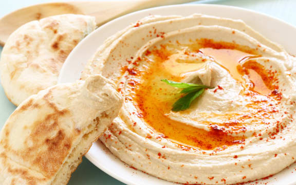 hummus dip plate on wooden table