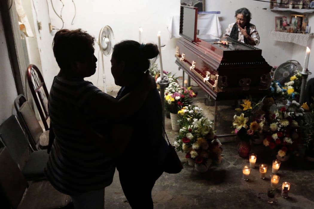 Relatives and friends attend Miguel Angel Jimenez Blanco's wake in Xaltianguis, Guerrero State, Mexico, on 9 August.