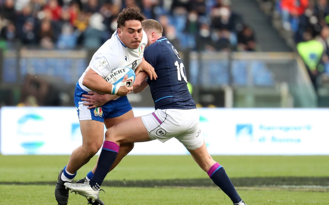 Italy's Ivan Nemer tackled by Finn Russell of Scotland