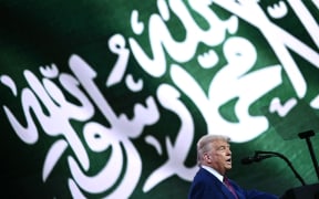 US President Donald Trump speaks during the Saudi-US investment forum at the King Abdul Aziz International Conference Center in Riyadh on May 13, 2025. Saudi Arabia on May 13 promised billions of dollars in deals with the United States from defence to artificial intelligence as it threw a lavish welcome for President Donald Trump on the first state visit of his second term. (Photo by Brendan SMIALOWSKI / AFP)