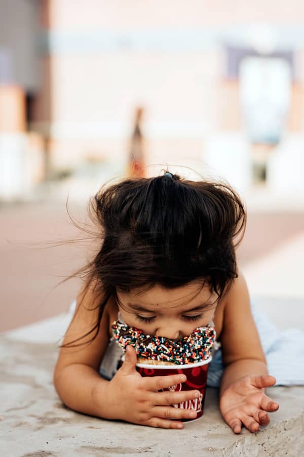 Kid eating ice cream, face first!