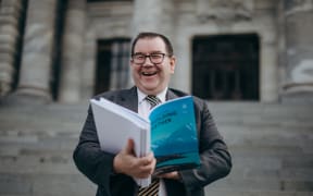 Grant Robertson holding the Budget 2020 ahead of its release.