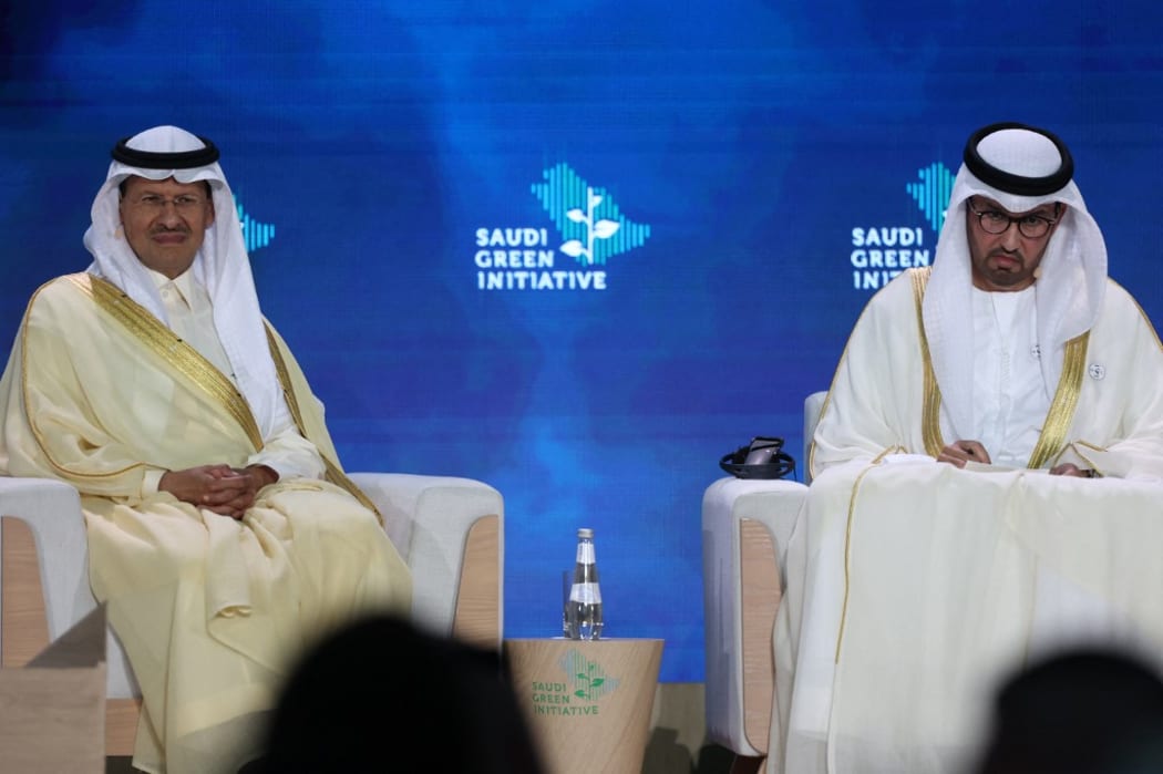 Saudi Energy Minister Abdulaziz bin Salman Al-Saud (L) and UAE's Minister of State and special envoy for climate change Sultan Ahmed al-Jaber (R) speak during the opening ceremony of the Saudi Green Initiative forum in the Saudi capital Riyadh.