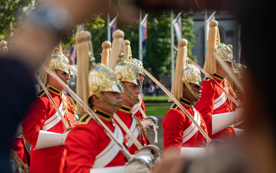Crowds gather to view the Queen to be laid in state