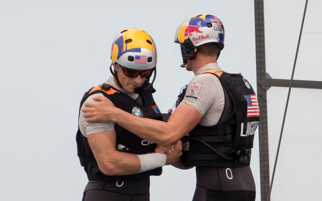 The Great Sound, Bermuda, 24th June 2017, Kyle Langford congratulates  Jimmy Spithill after Oracle Team USA beats Emirates Team New Zealand  in race six. Their first win of the regatta. Day three of racing in the America's Cup presented by louis Vuitton.
