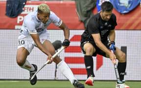 Belgium's Nelson Onana (L) and New Zealand's Kane Russell compete during a hockey game between Belgian national team Red Lions and New Zealand, in the group stage of the 2023 Men's FIH Pro League in Antwerp on June 18, 2023. (Photo by DIRK WAEM / Belga / AFP) / Belgium OUT