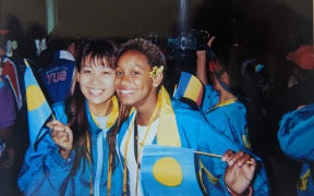 Nicole Hayes with Palau's swim coach Miko during the games.