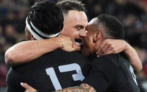 The All Blacks celebrate Israel Dagg's try against Wales.