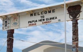 A sign at Wutung on the Papua New Guinea border with Indonesia.