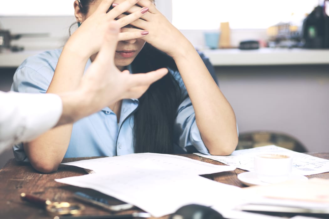 Boss threatening with finger his employee, isolated
