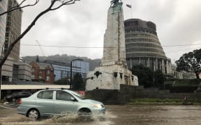 A car drives through water in Wellington