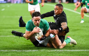 Hugo  Keenan of Ireland scores during the All Blacks vs. Ireland match in the third Steinlager series Test at Sky Stadium.