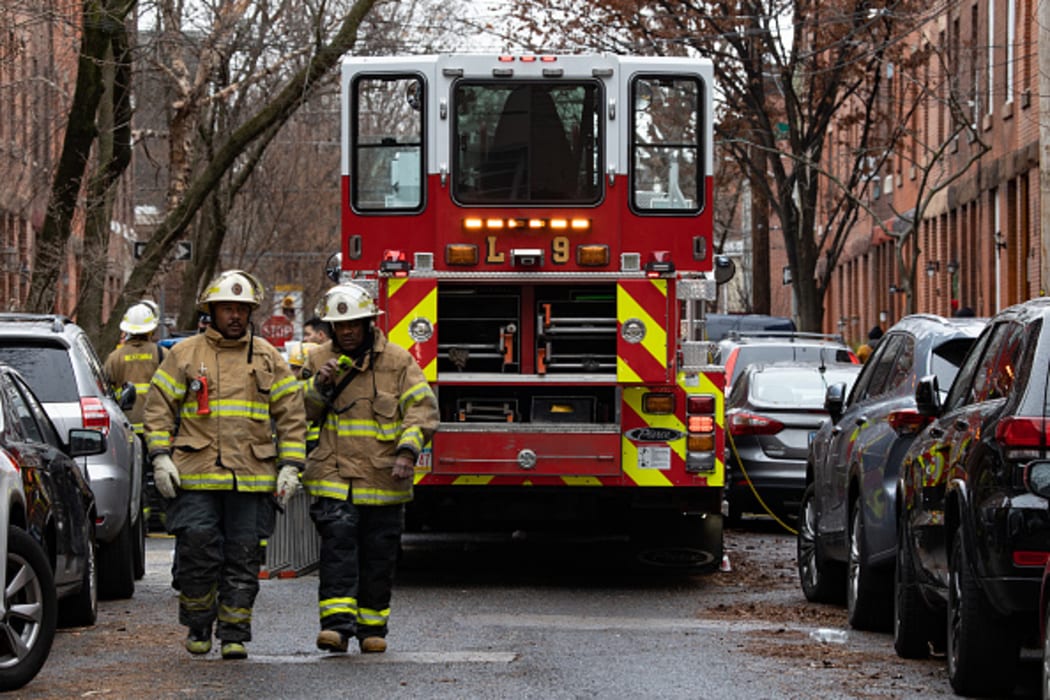 PHILADELPHIA, PA - JANUARY 05: Firefighters are pictured near the scene of the fatal fire in the Fairmount neighborhood on January 5, 2022 in Philadelphia, Pennsylvania.
