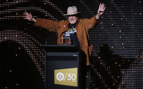 The Swingers' Buster Stiggs accepts the Silver Scroll award for 1981.