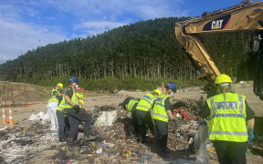 Police search a landfill in Porirua on 9 February, 2024, as part of a homicide investigation after the death of an elderly woman in the Wellington suburb of Khandallah in January.