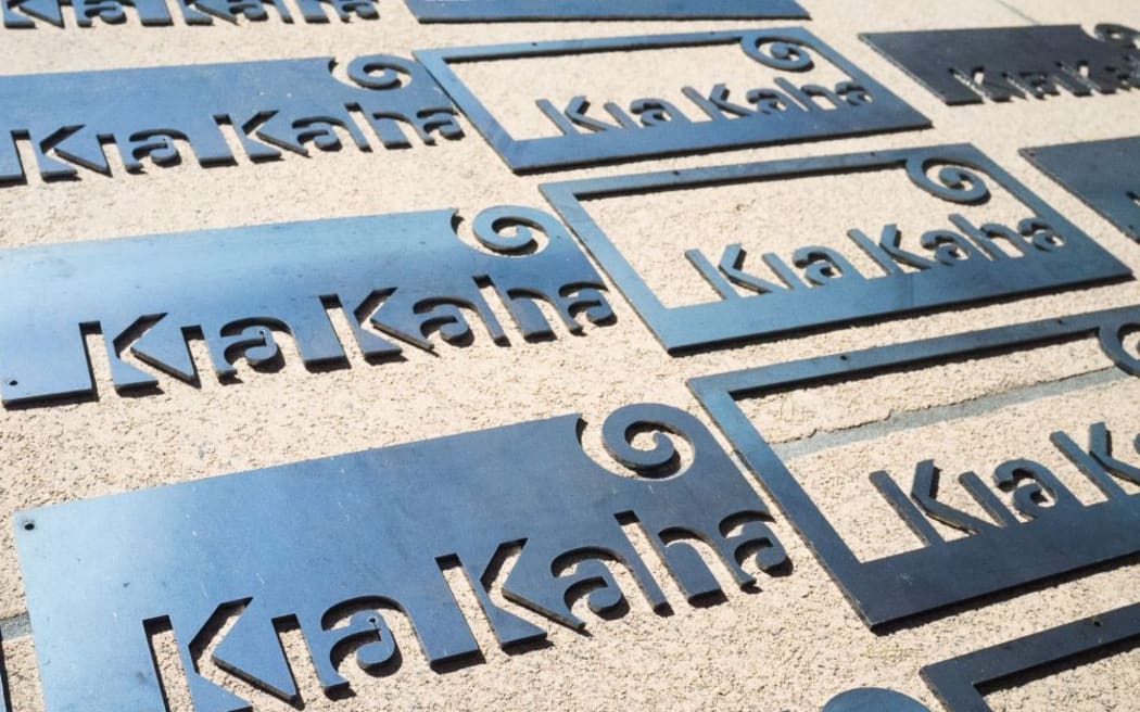The Kia Kaha signs Conrad sold to raise $800 for charity after the attacks.