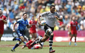 Fiji captain Meli Derenalagi races away from the Wales defence.