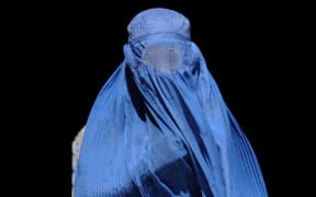 A burka-clad woman