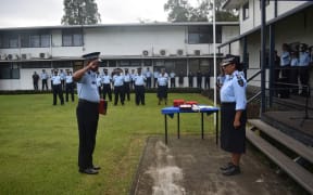 Retiring Inspector Surimalefo salutes Supervising Commissioner Matanga
