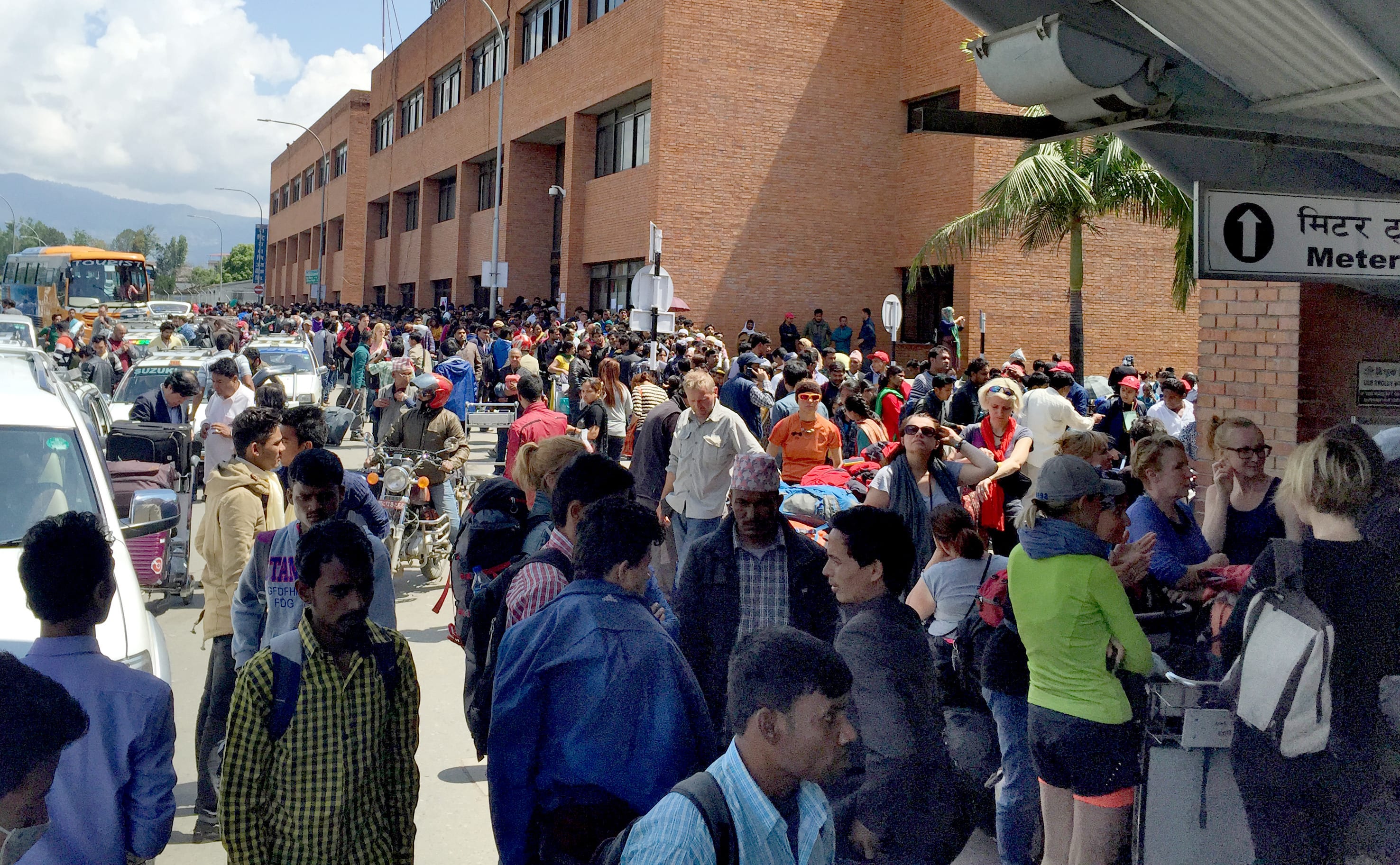 Tourists crowd Kathmandu airport waiting for a flight out. 27 April