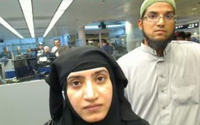 Syed Farook and Tashfeen Malik, as they were going through customs in Chicago's O'Hare International Airport in July 2014