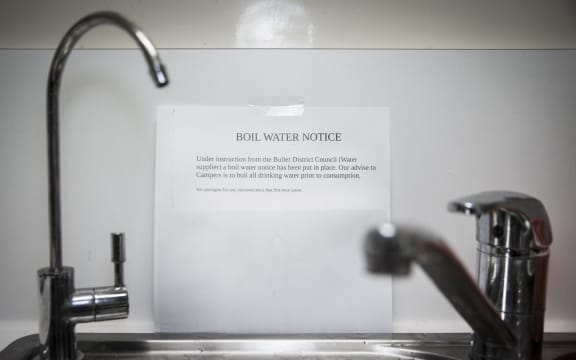 notice on wall behind a sink