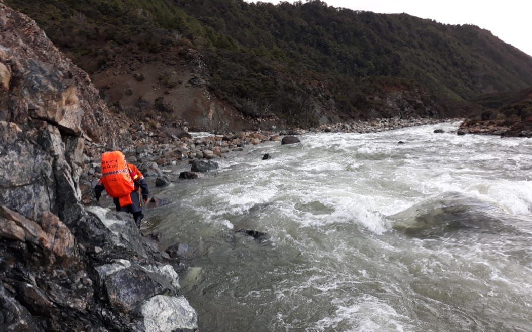 A search and rescue volunteer preparing to cross the Motueka River to reach an American hiker in November 2019.