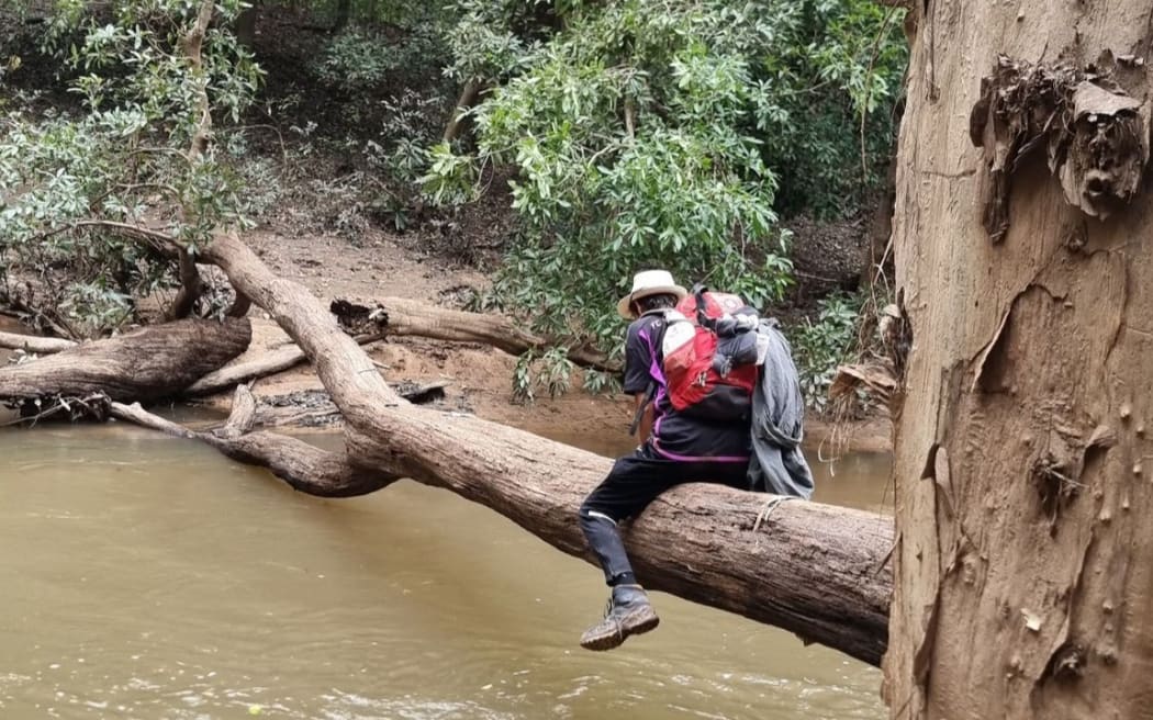 The pair had to cross a swollen river on a fallen tree during their ordeal.