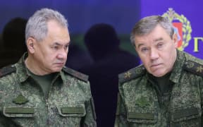 Russian Defence Minister Sergei Shoigu (L) and chief of the Russian General Staff Valery Gerasimov (R) are seen during a visit of Russian President to the joint staff of troops involved in Russia's military operation in Ukraine in an undisclosed place on December 17, 2022. (Photo by Gavriil GRIGOROV / Sputnik / AFP) / *Editor's note : this image is distributed by Russian state owned agency Sputnik.*