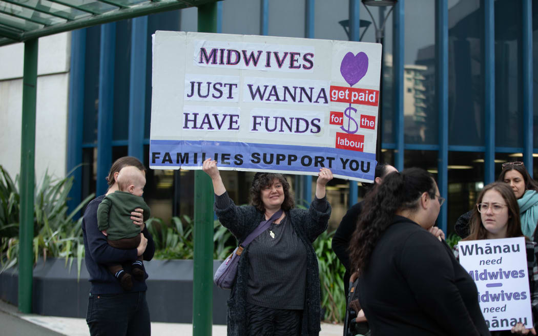 Midwives protest outside the High Court in Wellington.