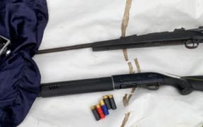 Police display a Carl Gustav .308 rifle, and  Escort Legacy semi-automatic 12-gauge shotgun (bottom).