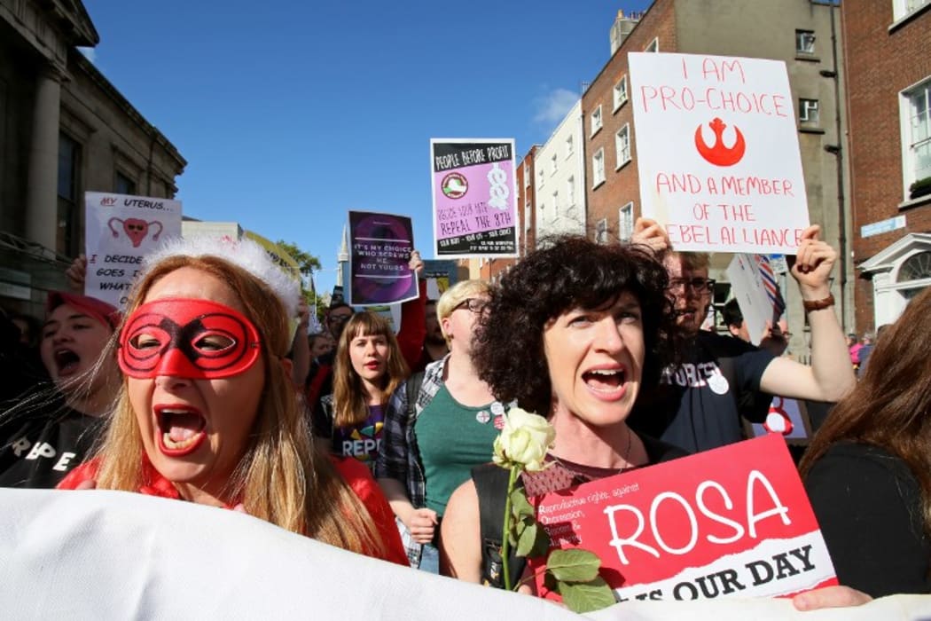 Protesters hold up placards as they take part in the March for Choice, calling for the legalising of abortion in Ireland after a referendum announcement.