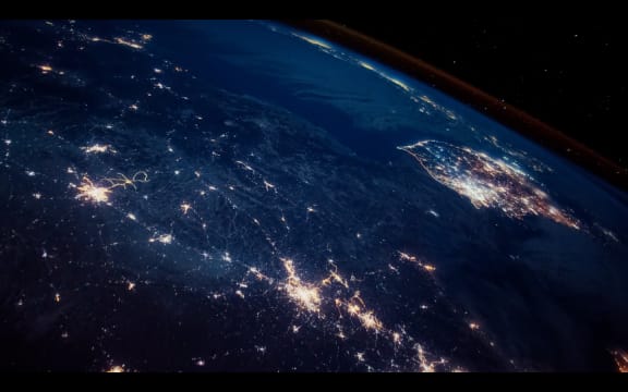 Frame from an Apple screensaver showing a satellite view of Earth