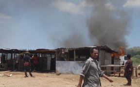 Burning stalls at the Kennedy Estate, Port Moresby